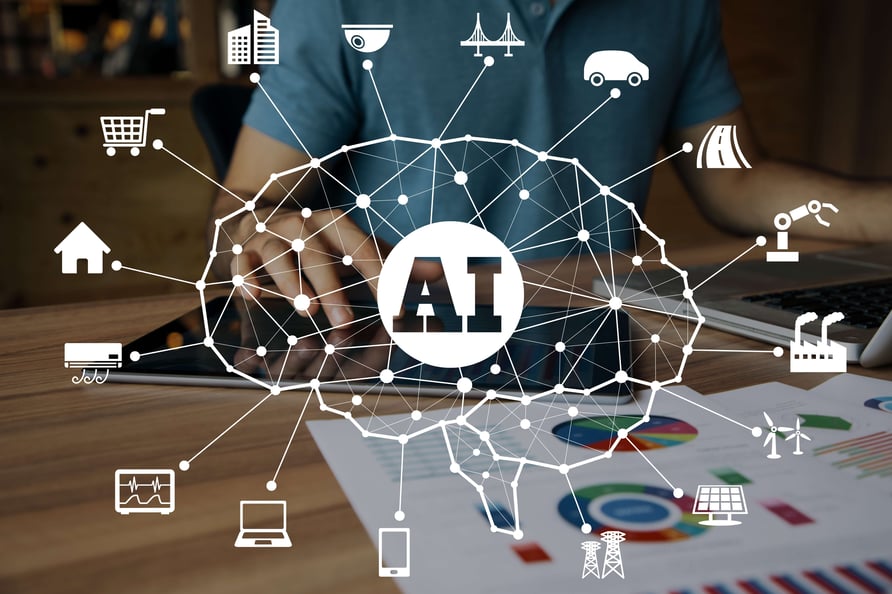 man with blue shirt at a laptop on wooden table with colorful graphs and an overlay of an AI brain