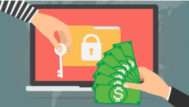 graphic ov a laptop with a key and dollar bills to pay ransom
