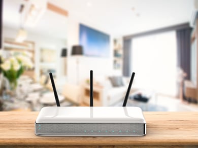 Wi-Fi router on light wood desk in living room